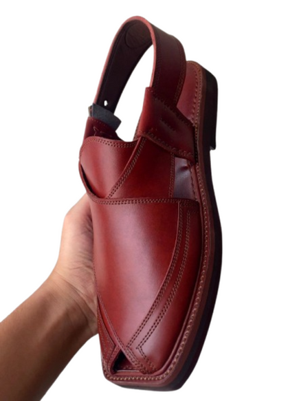 Handmade traditional Peshawari chappal for men held in hand side view