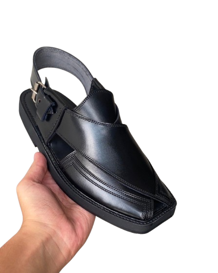 Handmade traditional Peshawari chappal for men held in hand side view